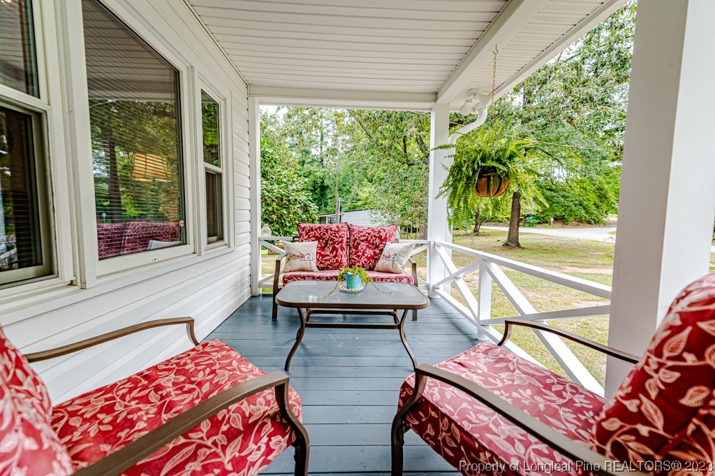 2411 Colon Road Sanford, NC 27330 - Photo 4 of 50 a balcony with furniture and a potted plant