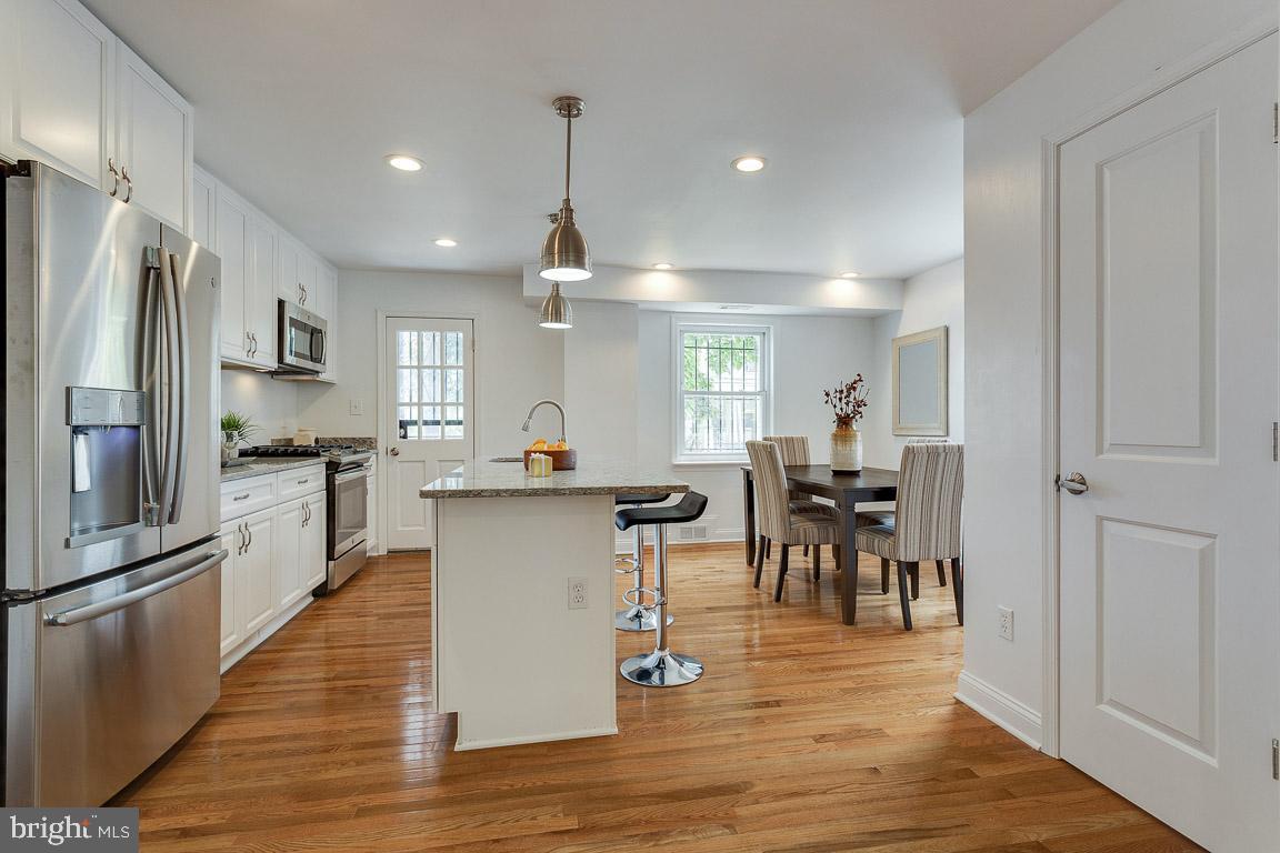 319 Raleigh Street Southeast Washington, DC 20032 - Photo 4 of 35 Open kitchen and dining room
