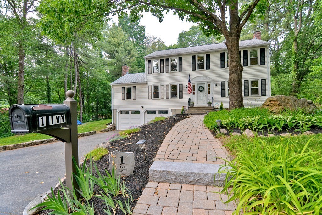 1 Ivy Lane Ashland, MA 01721 - Photo 1 of 42 a view of a house with backyard sitting area and garden