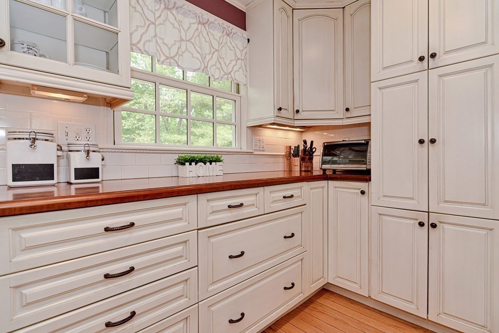 1 Ivy Lane Ashland, MA 01721 - Photo 14 of 42 a kitchen with appliances cabinets and a window