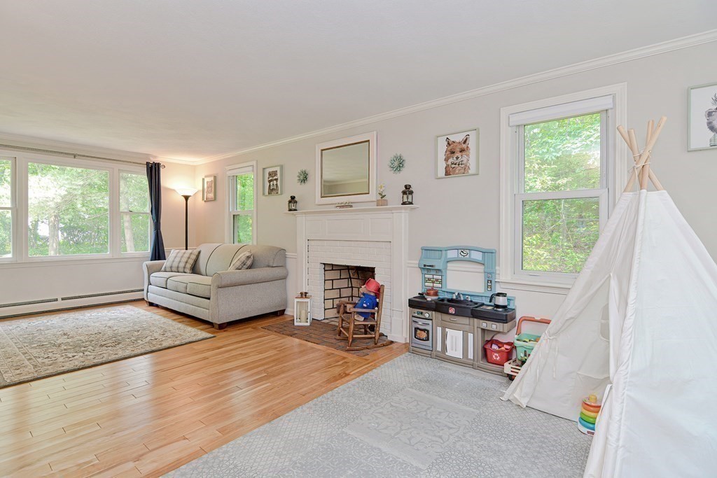 1 Ivy Lane Ashland, MA 01721 - Photo 18 of 42 a living room with furniture and a fireplace