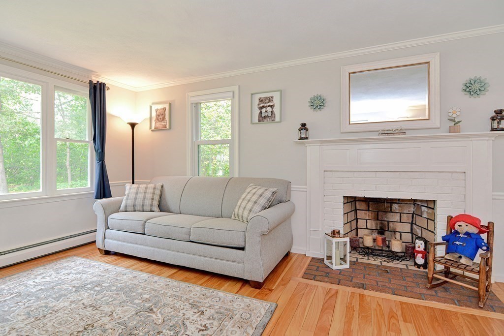 1 Ivy Lane Ashland, MA 01721 - Photo 20 of 42 a living room with furniture and a fireplace