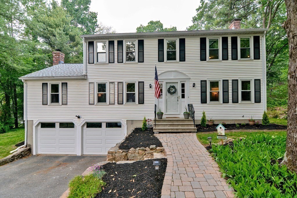 1 Ivy Lane Ashland, MA 01721 - Photo 2 of 42 a front view of a house with a yard