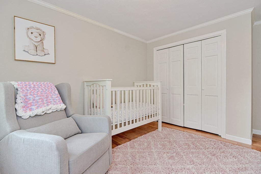 1 Ivy Lane Ashland, MA 01721 - Photo 26 of 42 a living room with furniture and baby crib