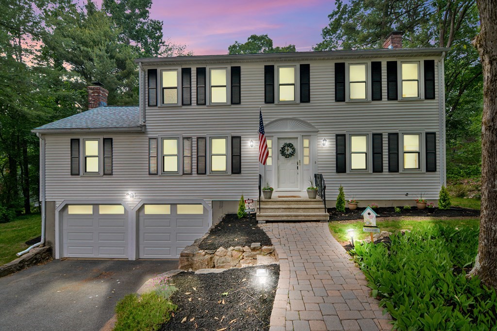 1 Ivy Lane Ashland, MA 01721 - Photo 3 of 42 a front view of a house with a yard and outdoor seating