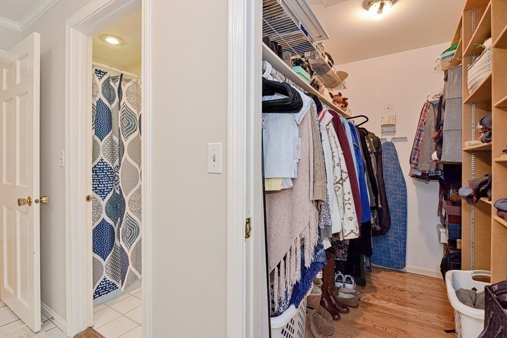 1 Ivy Lane Ashland, MA 01721 - Photo 33 of 42 a view of walk in closet with clothes and shoes