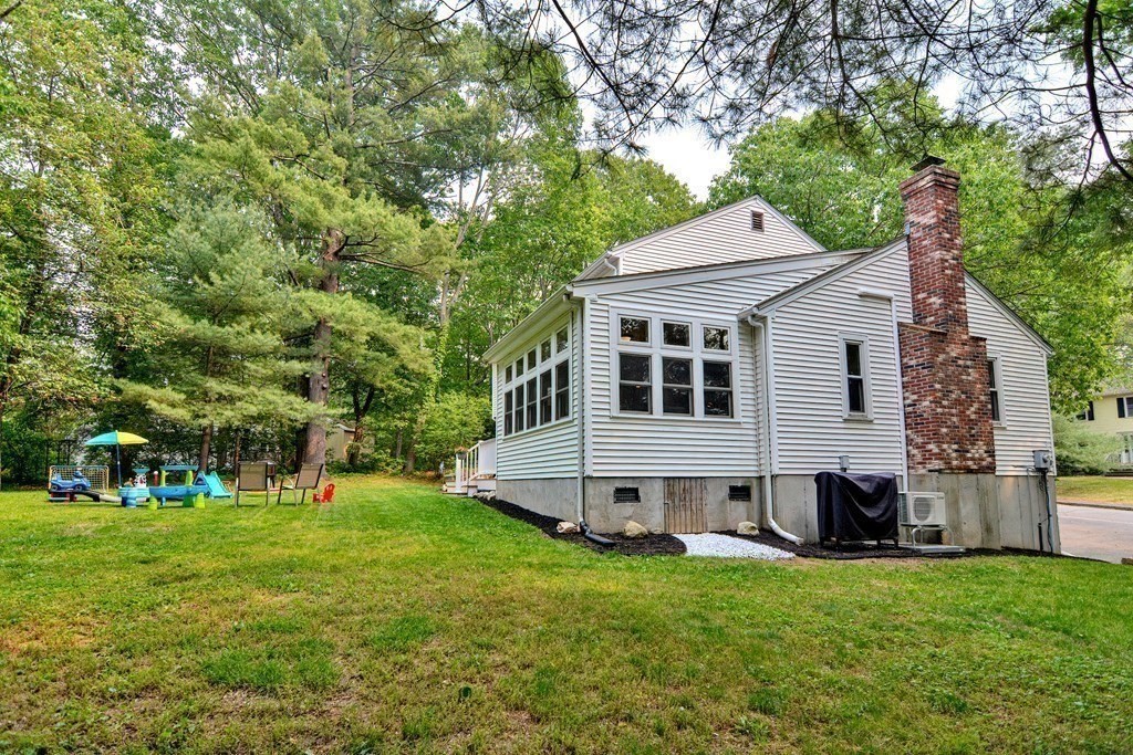 1 Ivy Lane Ashland, MA 01721 - Photo 35 of 42 a view of a white house with a big yard and large trees