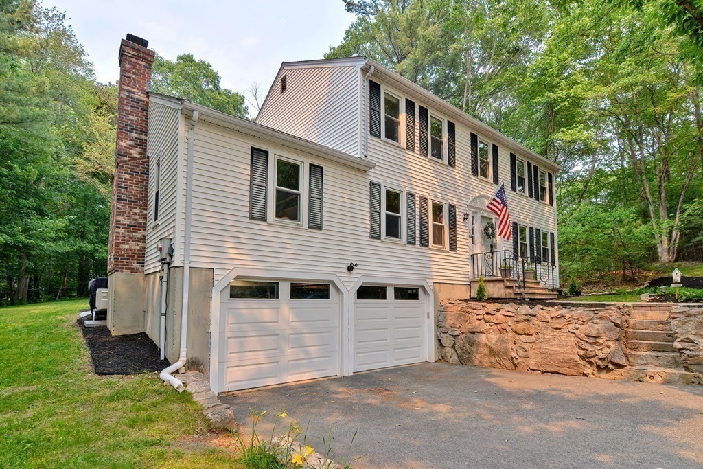 1 Ivy Lane Ashland, MA 01721 - Photo 38 of 42 a front view of a house with a yard