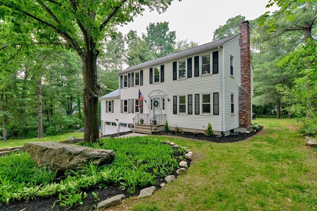 1 Ivy Lane Ashland, MA 01721 - Photo 4 of 42 a house that is sitting in the grass