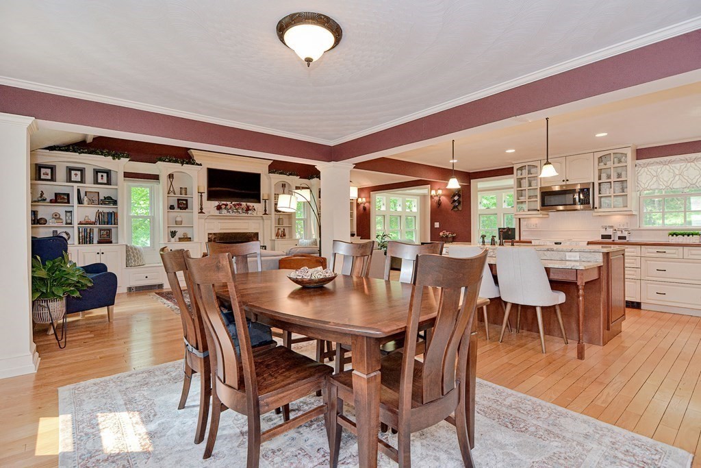1 Ivy Lane Ashland, MA 01721 - Photo 7 of 42 a view of a dining room with furniture and wooden floor