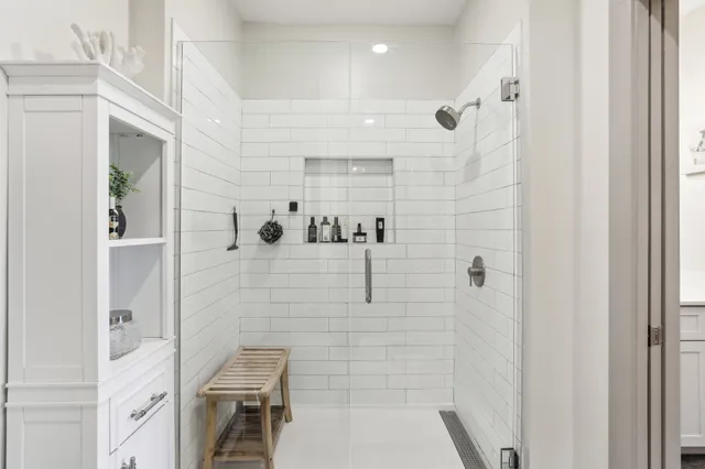 a bathroom with a bathtub and shower