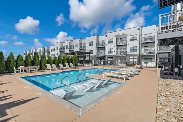 a view of a patio with swimming pool