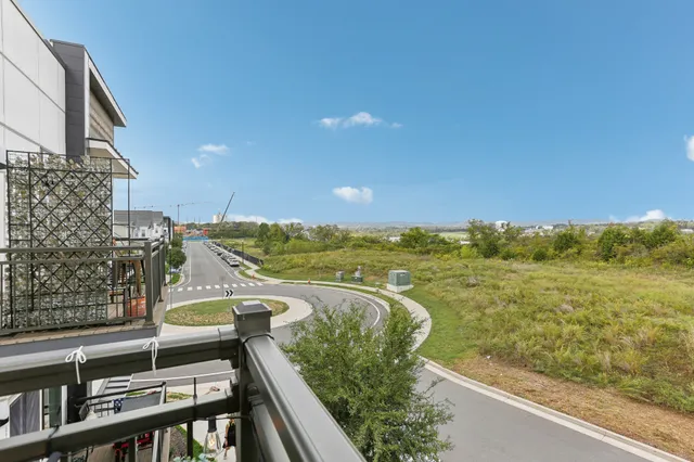 a view of a balcony with an ocean