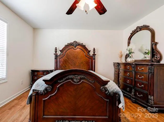 a bedroom with a bed and a television