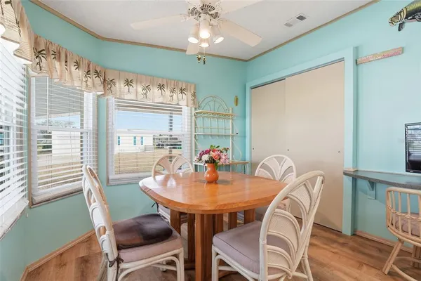 a view of a dining room with furniture window and outside view