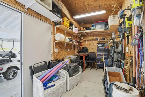 a front view of a house with a yard outdoor seating and mountain view