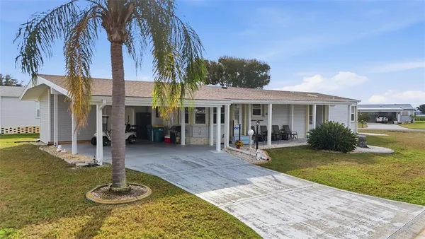 an aerial view of a house with outdoor space