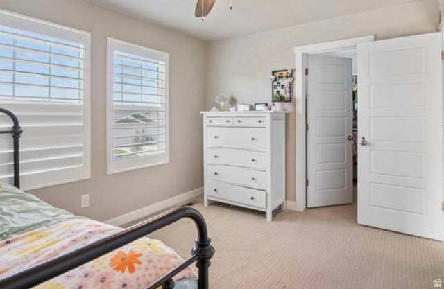 1295 East Granite Peak Road Eagle Mountain, UT 84005 - Photo 21 of 35 Spacious room featuring neutral paint, two windows with white plantation shutters, and light-colored carpeting
