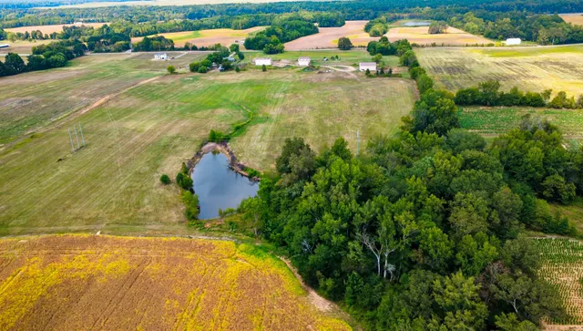 a view of a swimming pool and an outdoor seating