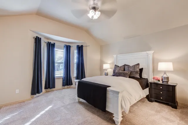 a bathroom with double vanity sink and a mirror