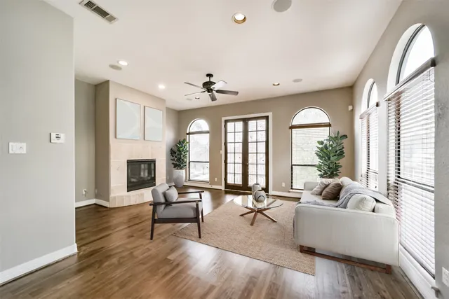 a living room with furniture and a fireplace
