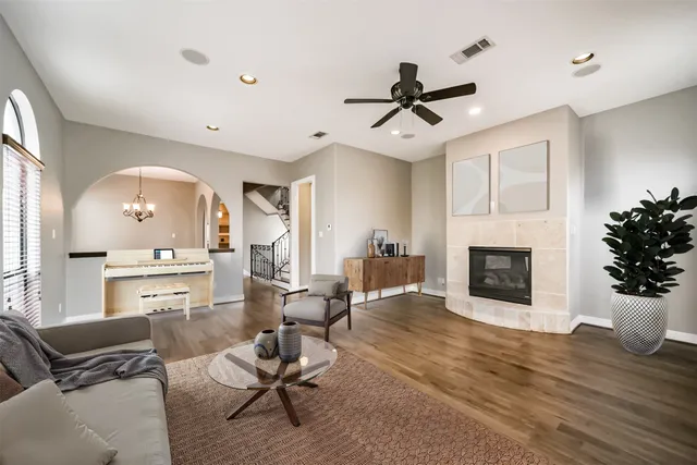 a living room with furniture and a fireplace