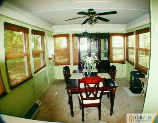 22 Caldwell Road Edison, NJ 08817 - Photo 2 of 8 a view of a dining room with furniture window and outside view