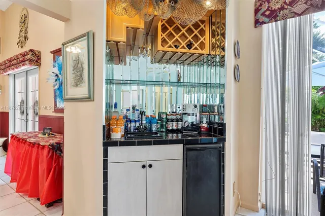 a kitchen with a sink and a refrigerator