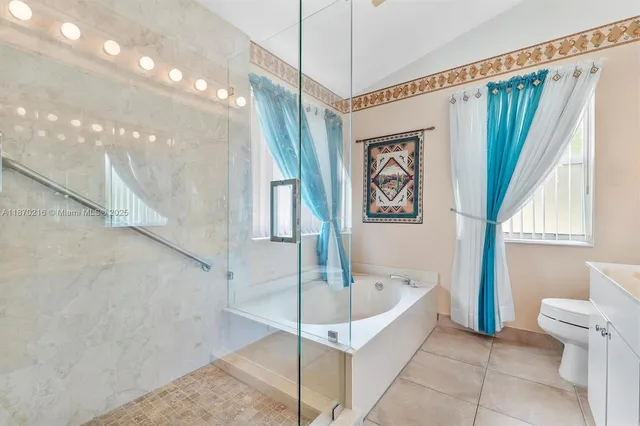 a bathroom with a bathtub and a shower