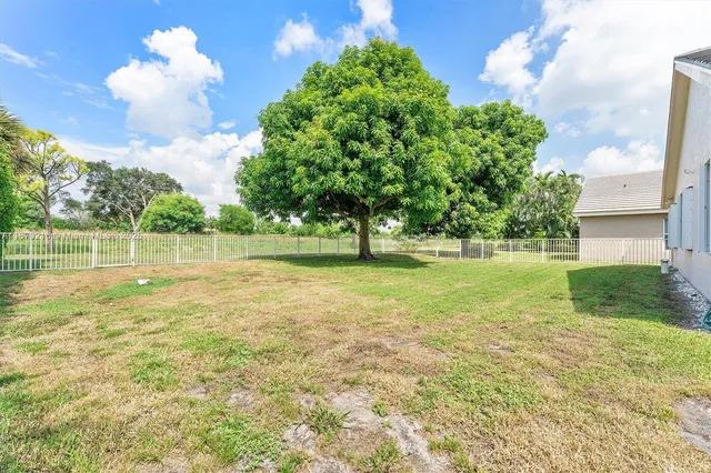 a view of a golf course with a big yard