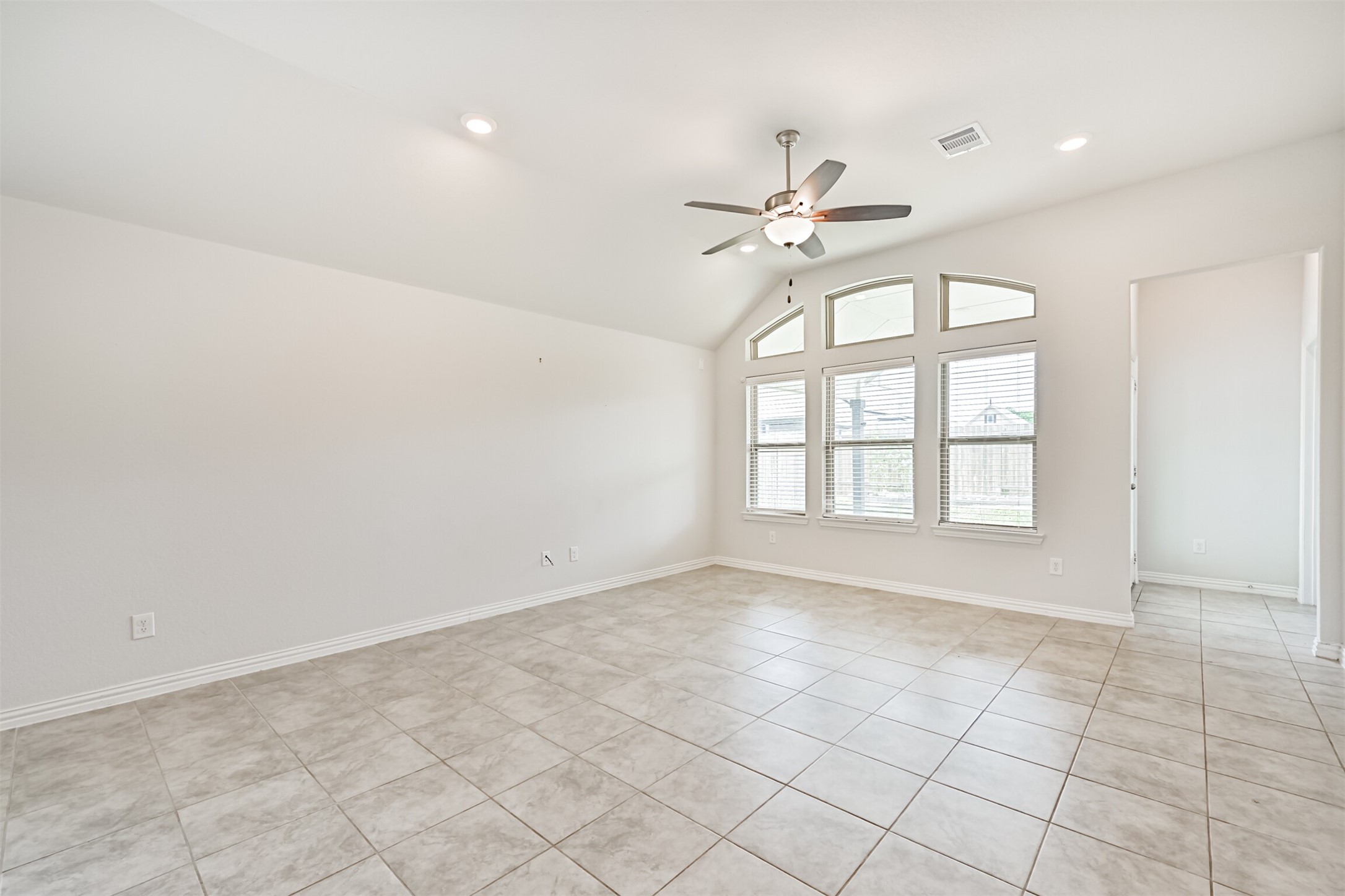7019 Terra Drive Manvel, TX 77578 - Photo 15 of 41 wooden floor in an empty room with a window