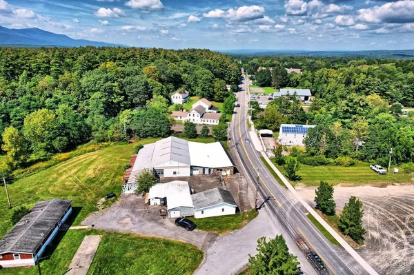 an aerial view of a house with a garden