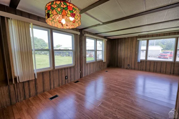 a view of a room with furniture window and wooden floor