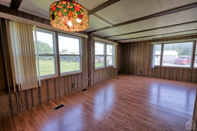 a view of a room with furniture window and wooden floor