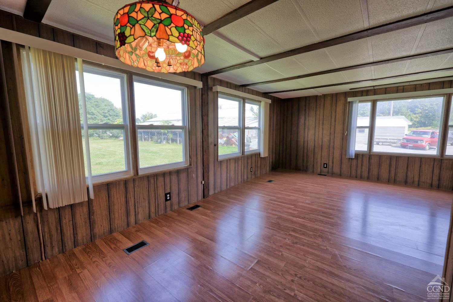 299 Main Street Cairo, NY 12413 - Photo 15 of 85 an empty room with wooden floor and windows