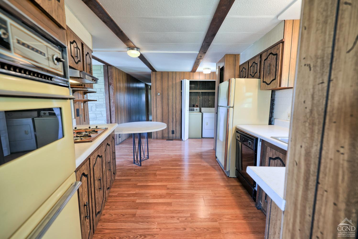 299 Main Street Cairo, NY 12413 - Photo 16 of 85 a kitchen with stainless steel appliances granite countertop a refrigerator a stove and a sink with wooden floor