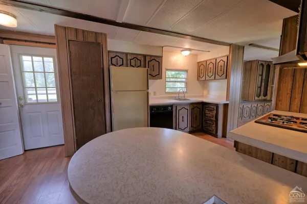 a bathroom with a granite countertop toilet a sink and bathtub