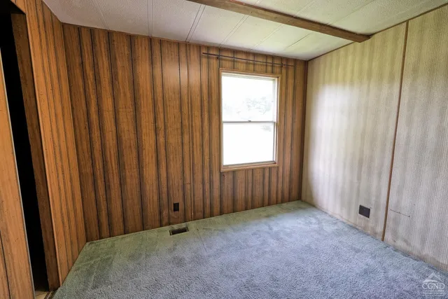a aerial view of a house with a garden and plants