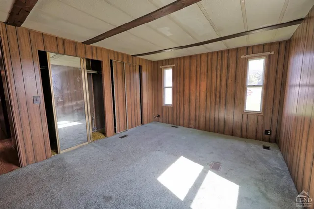 an aerial view of a house with a yard and potted plants