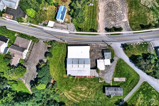 a view of a house with a yard deck and a garden
