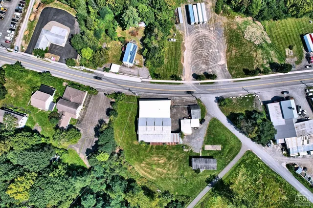 an aerial view of a house with a garden