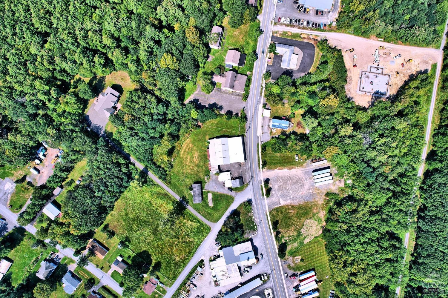299 Main Street Cairo, NY 12413 - Photo 41 of 85 an aerial view of a house with a yard and garden