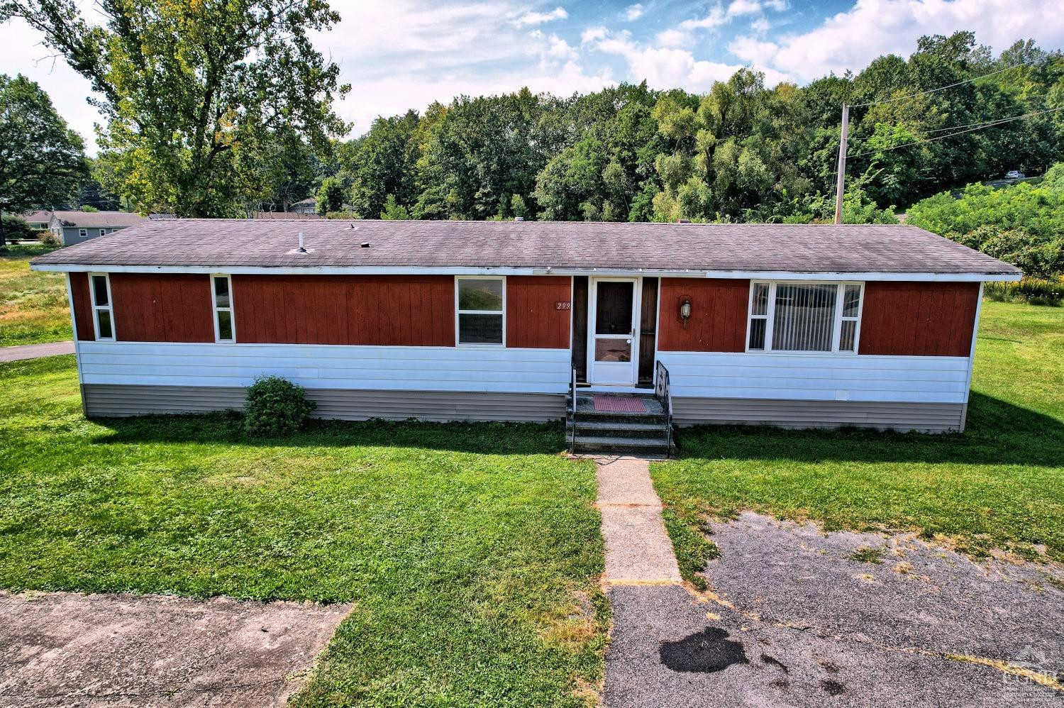 299 Main Street Cairo, NY 12413 - Photo 6 of 85 a front view of a house with garden