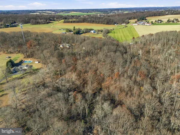 a view of a lake with houses in the background