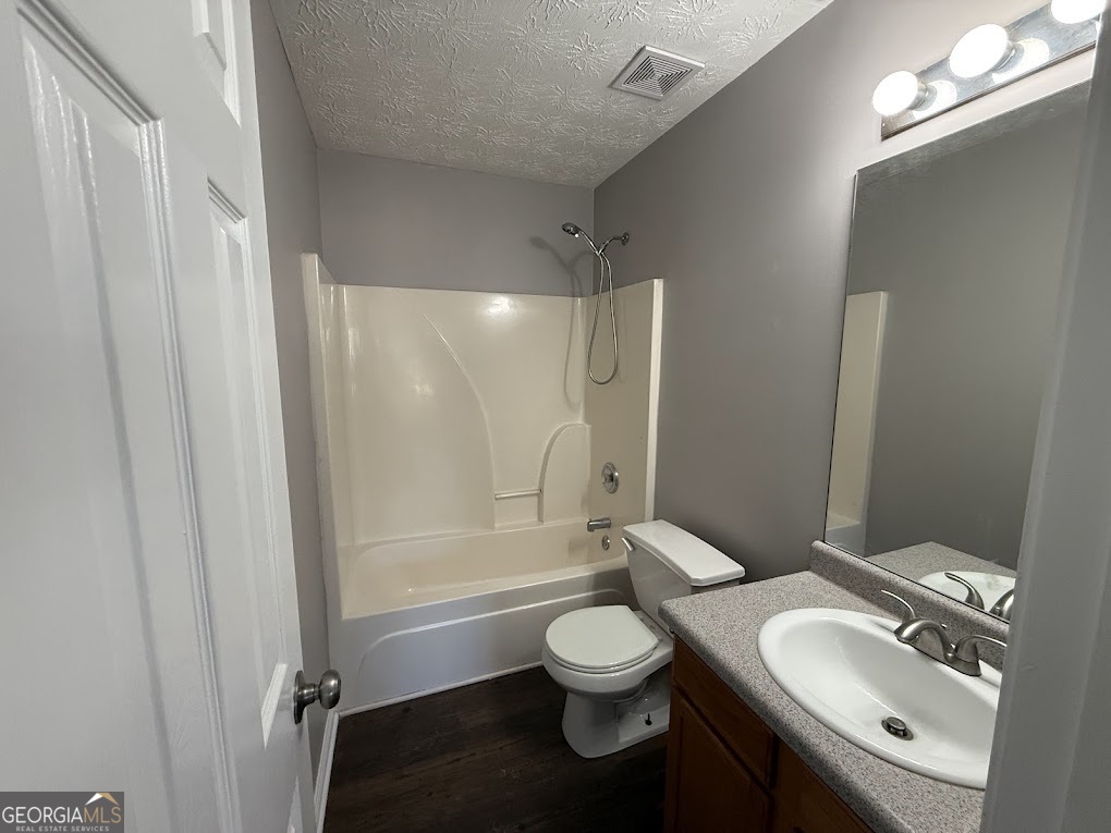 419 Shenandoah Court Winder, GA 30680 - Photo 11 of 12 a bathroom with a sink toilet and shower