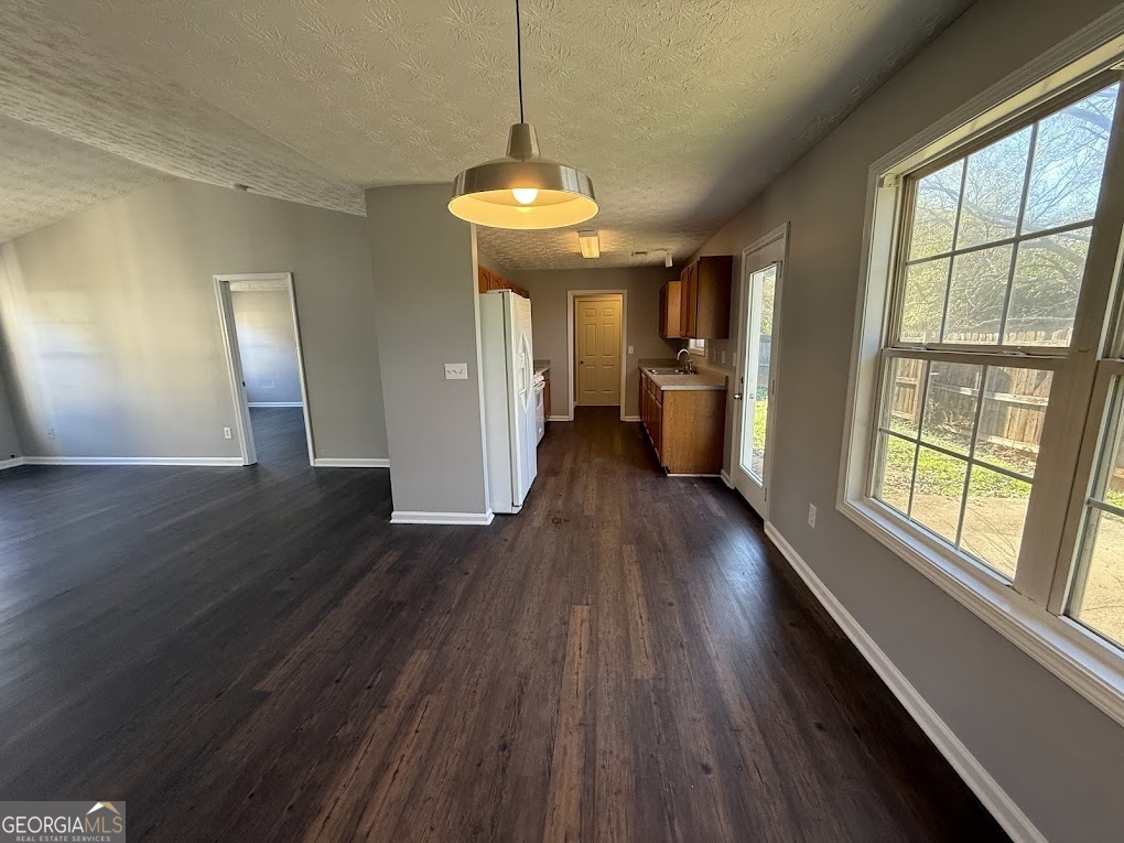 419 Shenandoah Court Winder, GA 30680 - Photo 3 of 12 a view of a room with wooden floor fireplace and windows