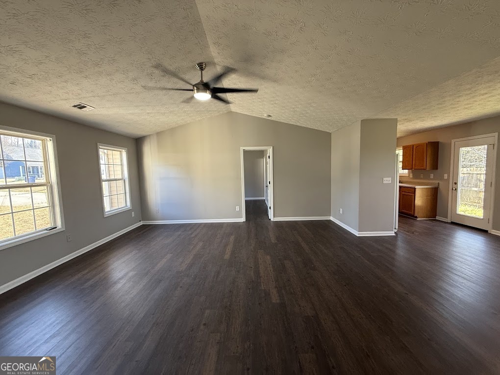 419 Shenandoah Court Winder, GA 30680 - Photo 6 of 12 a view of an empty room with window and wooden floor