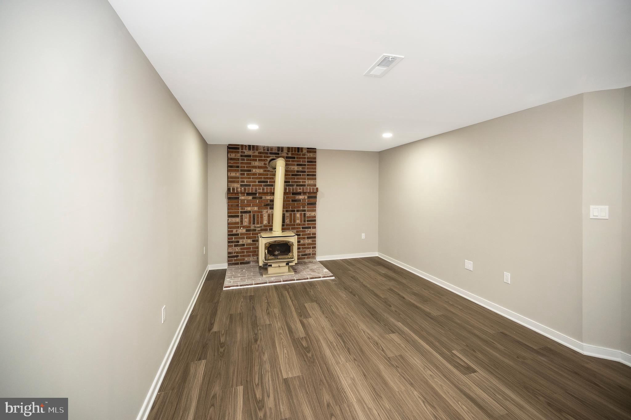 12237 Ward Road King George, VA 22485 - Photo 45 of 54 Recreation Room with Wood Stove