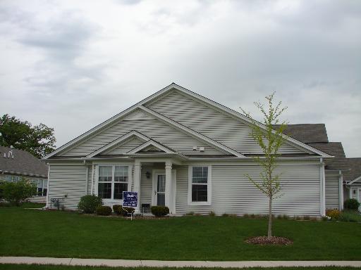 13552 Delaney Road, Unit 1 Huntley, IL 60142 - Photo 1 of 1 a view of a yard in front of a house