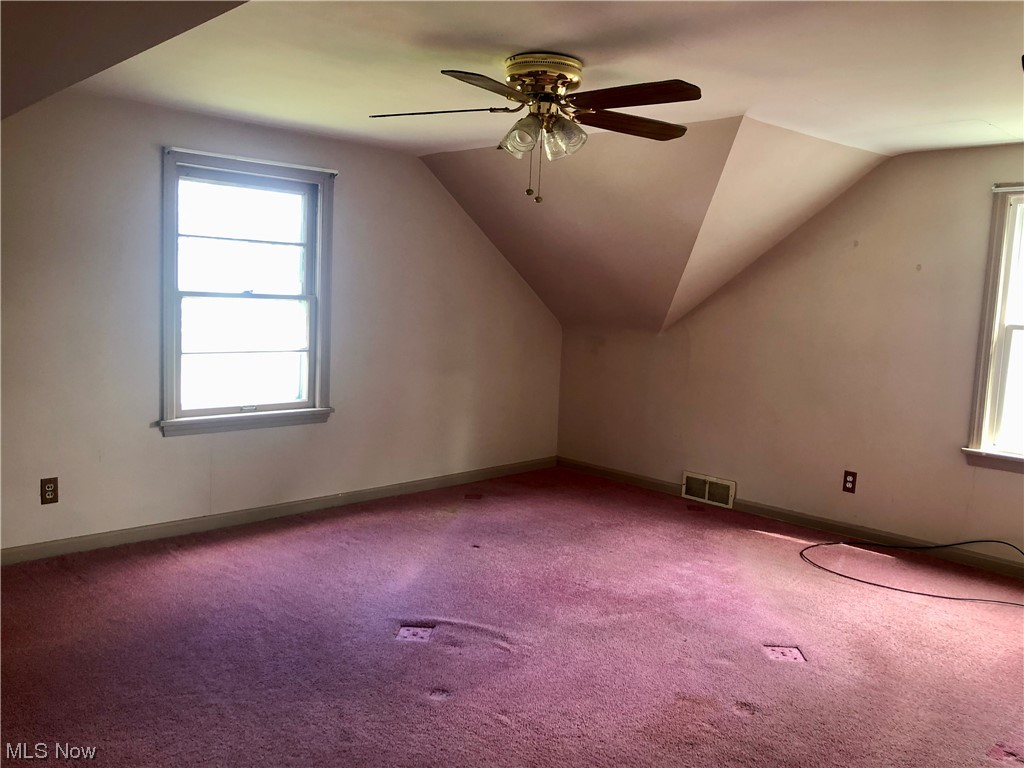 244 Meriden Road Painesville, OH 44077 - Photo 10 of 13 vaulted ceiling, and ceiling fan